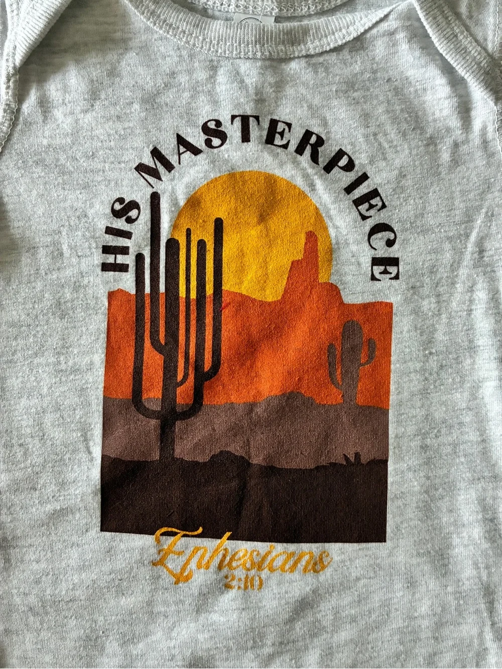 His Masterpiece Ephesians 2:10  Desert Graphic Onesie Heathered Gray, 12 mo NEW!